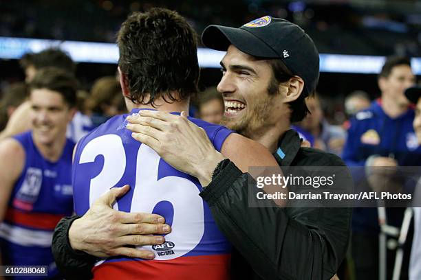 Easton Wood of the Bulldogs embraces Brad Lynch of the Bulldogs after the VFL Grand Final match between the Casey Scorpions and the Footscray...