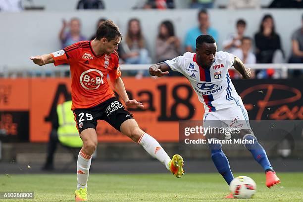 Maxwel Cornet of Lyon and Vincent Le Goff of Lorient during the Ligue 1 match between FC Lorient and Olympique Lyonnais at Stade du Moustoir on...