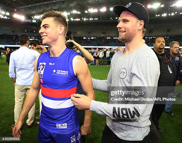 Jake Stringer of the Bulldogs congratulates Declan Hamilton of Footscray during the VFL Grand Final match between the Casey Scorpions and the...