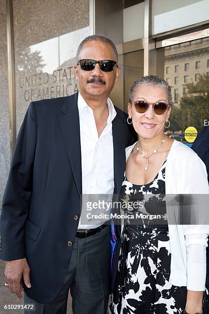 Eric Holder and wife Dr. Sharon Malone arrives at the American History Museum for the dedication ceremony of the National Museum of African American...