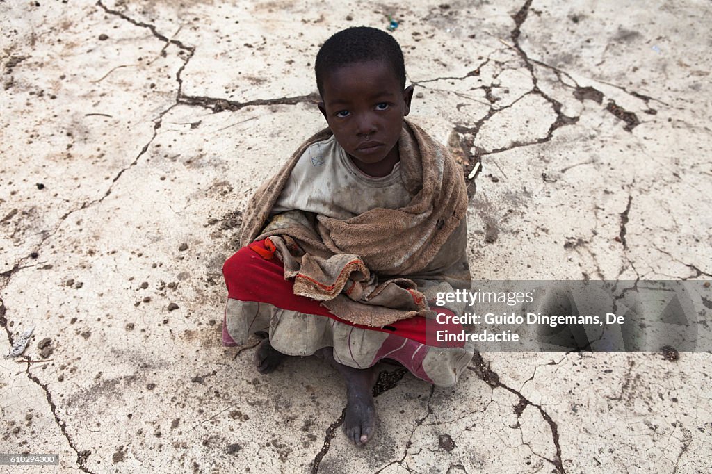 Young girl on cracked concrete in Malawi (2016)