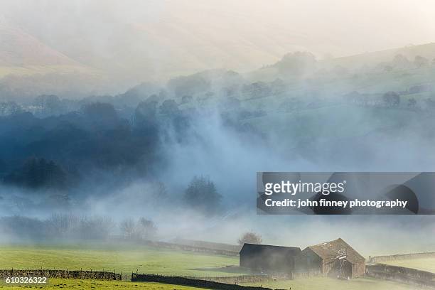 rolling landscape of derbyshire with rising morning mist. english peak district. uk. europe. - pennines stockfoto's en -beelden