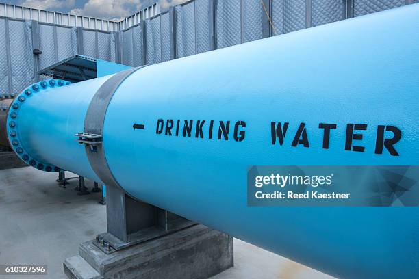 fresh drinking water leaves the desalination plant carlsbad, california, united states. - carlsbad california stock pictures, royalty-free photos & images