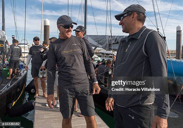 Nika boat owner Vladimir Prosikhin and tactician Ed Baird and the sailboat crew celebrate having won the second race of the day during Fleet Race on...