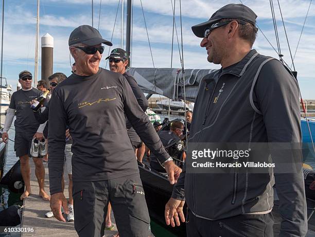 Nika boat owner Vladimir Prosikhin and tactician Ed Baird and the sailboat crew celebrate having won the second race of the day during Fleet Race on...
