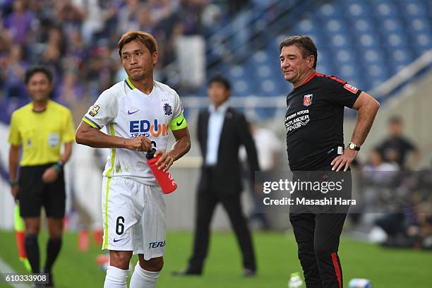 Mihailo Petrovic,coach of Urawa Red Diamonds and Toshihiro Aoyama of Sanfrecce Hiroshima look on during the J.League match between Urawa Red Diamonds...