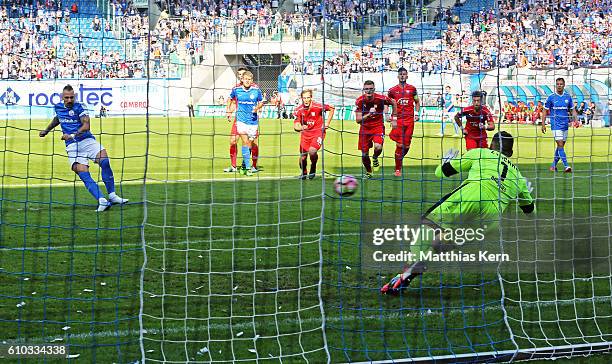 Timo Martin Gebhardt of Rostock scores the first goal after penalty during the third league match between FC Hansa Rostock and FSV Zwickau at...