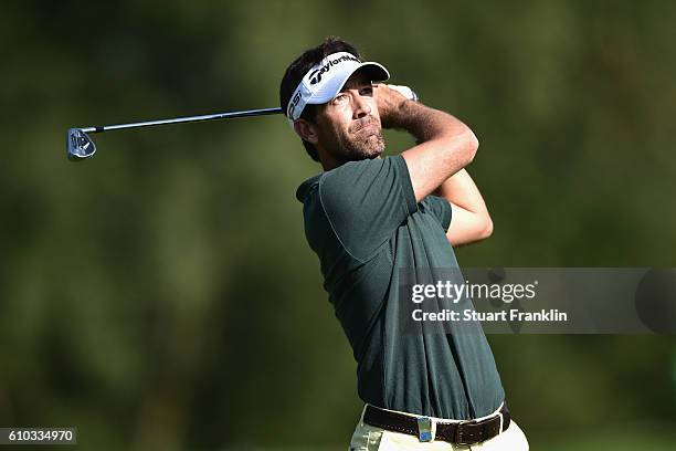 Eduardo de la Riva of Spain watches the flight of his ball after playing an iron shot during the final round of the Porsche European Open at Golf...