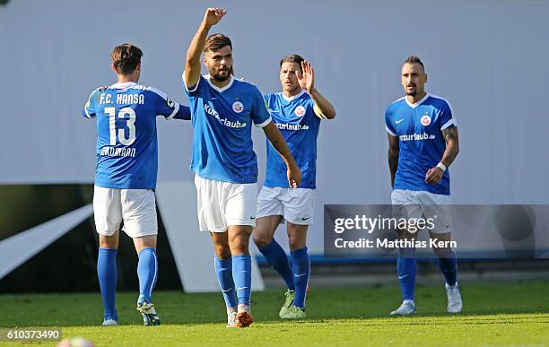 Kerem Buelbuel of Rostock jubilates after scoring the fourth goal during the third league match between FC Hansa Rostock and FSV Zwickau at...