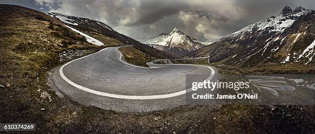 curved mountain road - winding road stock-fotos und bilder