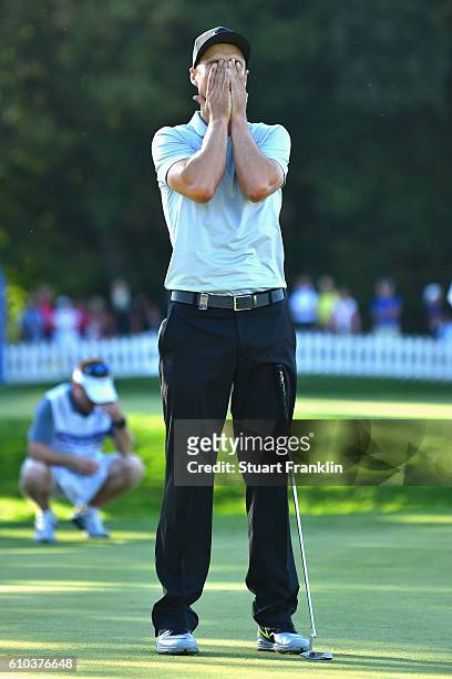 Ross Fisher of England reacts after a missed put on the 18th green during the final round of the Porsche European Open at Golf Resort Bad Griesbach...
