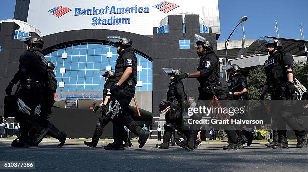 Charlotte Mecklenburg Police Department deploy outside of Bank of America Stadium prior to the game between the Carolina Panthers and the Minnesota...