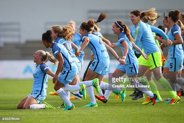 Toni Duggan of Manchester City Women and team mates celebrate as they win the WSL title after the WSL 1 match between Manchester City Women and...