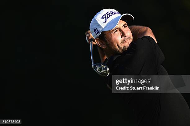 Alexander Levy of France watches the flight of his ball as he tees of in the second play off hole during the final round of the Porsche European Open...