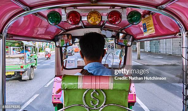 view from the back seat of a pink tuk tuk in bangkok thailand - 三輪タクシー ストックフォトと画像