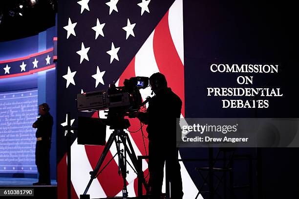 Television news crews prepare for the first presidential debate featuring Democratic presidential candidate Hillary Clinton and Republican...