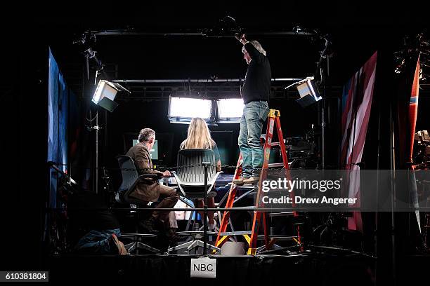 Television news crews prepare for the first presidential debate featuring Democratic presidential candidate Hillary Clinton and Republican...