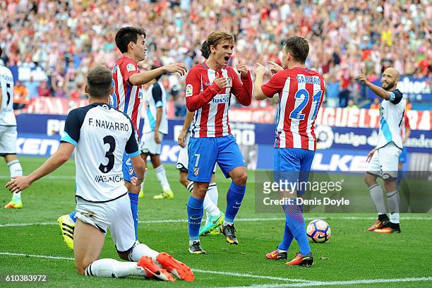 Antoine Greizmann of Club Atletico de Madrid celebrates with Kevin Gameiro after scoring his team's opening goal during the La Liga match between...