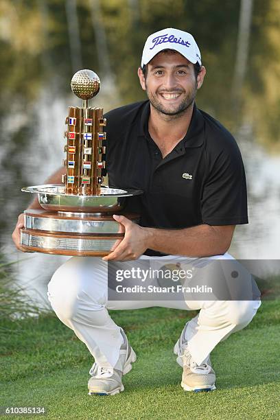 Winner, Alexander Levy of France poses with the trophy as he celebrates after the final round of the Porsche European Open at Golf Resort Bad...