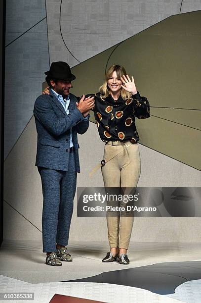 Adriano Giannini and Gaia Trussardi acknowledge the applause of the audience at the Trussardi show during Milan Fashion Week Spring/Summer 2017 on...