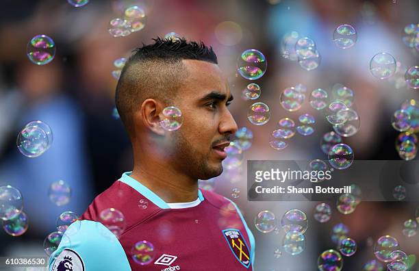 Bubbles float past Dimitri Payet of West Ham United prior to the Premier League match between West Ham United and Southampton at London Stadium on...