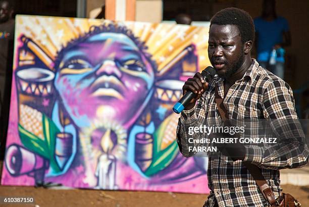 Jacob Bul, co-founder and member of the activist art organisation #AnaTaban addresses the audience in Gudele area, Juba, on September 25, 2016. The...