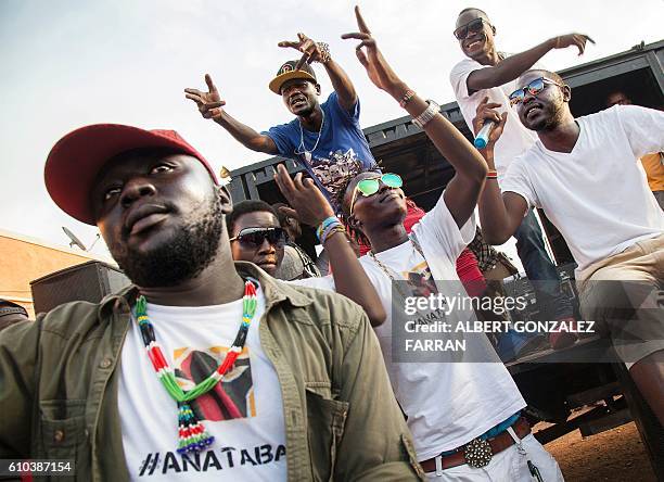 Singers and members of the activist art organisation #AnaTaban perform in the streets of Gudele, in Juba, South Sudan, on September 25, 2016. The...