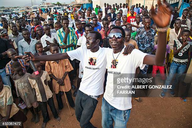 Members of the activist art organisation #AnaTaban perform in the streets of Gudele, in Juba, South Sudan, on September 25, 2016. The activist...