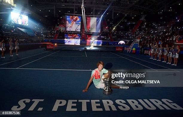 Germanys Alexander Zverev poses with his trophy after winning the St. Petersburg ATP Open final tennis match against Switzerlands Stanislas Wawrinka...