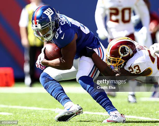 Sterling Shepard of the New York Giants carries the ball as DeAngelo Hall of the Washington Redskins defends at MetLife Stadium on September 25, 2016...