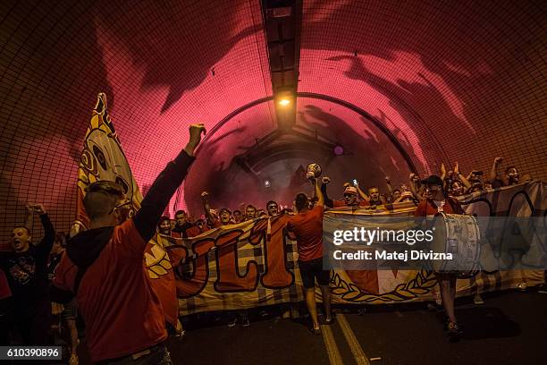 Slavia Prague fans march toward Generali Arena Stadium for the derby match against Sparta Prague through road tunnel on September 25, 2016 in Prague,...