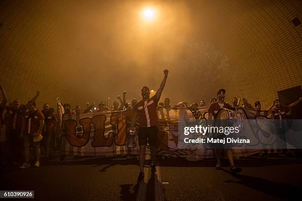 Slavia Prague fans march toward Generali Arena Stadium for the derby match against Sparta Prague through road tunnel on September 25, 2016 in Prague,...