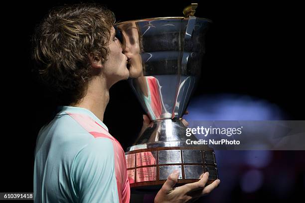 Alexander Zverev of Germany kisses his trophy after winning the St. Petersburg Open ATP tennis tournament final match against Stan Wawrinka of...