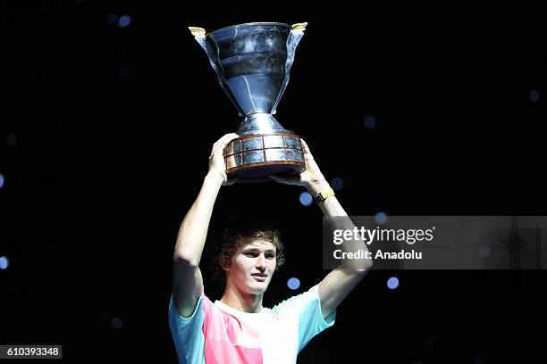 Alexander Zverev poses for a photo with his trophy after he win the final game of Men's singles of Saint-Petersburg Open 2016 International Tennis...