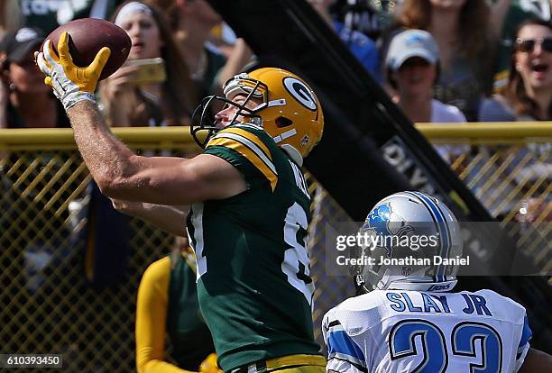 Jordy Nelson of the Green Bay Packers catches a touchdown pass in the second quarter over Darius Slay of the Detroit Lions at Lambeau Field on...