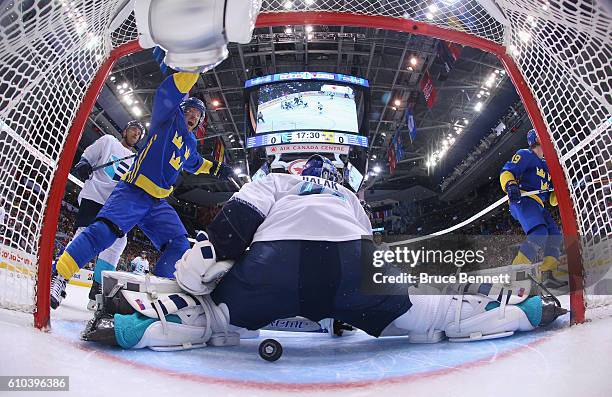Patric Hornqvist of Team Sweden celebrates a second period goal by Nicklas Backstrom against Jaroslav Halak of Team Europe at the semifinal game...
