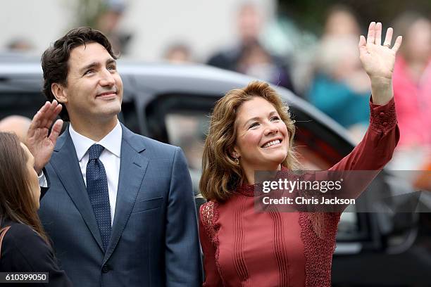Prime Minister Justin Trudeau and his wife Sophie Gregoire-Trudeau arrive to the Immigrant Services Society, a charitable organisation that provides...