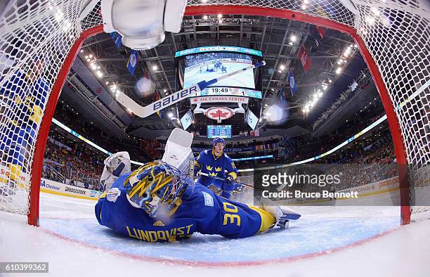 Henrik Lundqvist of Team Sweden loses his stick during a goal by Tomas Tatar of Team Europe during the third period at the semifinal game during the...