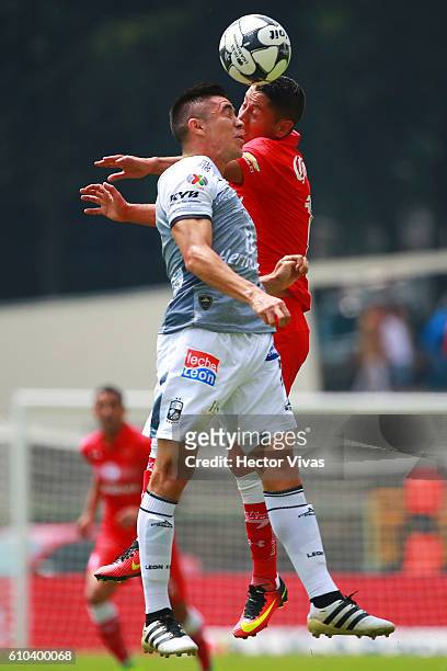 Carlos Esquivel of Toluca struggles for the ball with Efrain Velarde of Leon during the 11th round match between Toluca and Leon as part of the...
