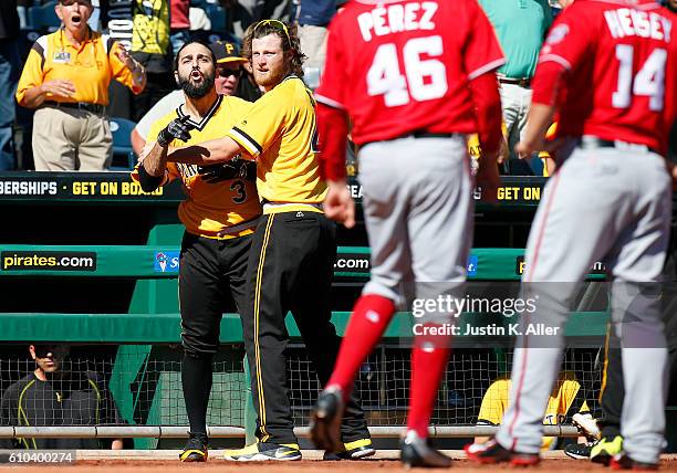 Sean Rodriguez of the Pittsburgh Pirates is held back by Gerrit Cole during a bench clearing altercation against the Washington Nationals at PNC Park...