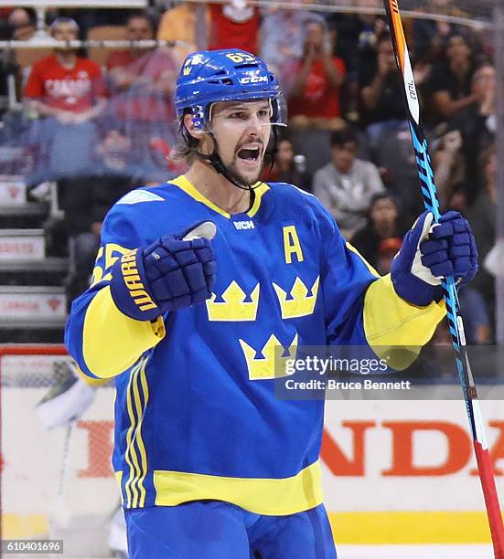 Erik Karlsson of Team Sweden celebrates his third period goal against Team Europe at the semifinal game during the World Cup of Hockey tournament at...