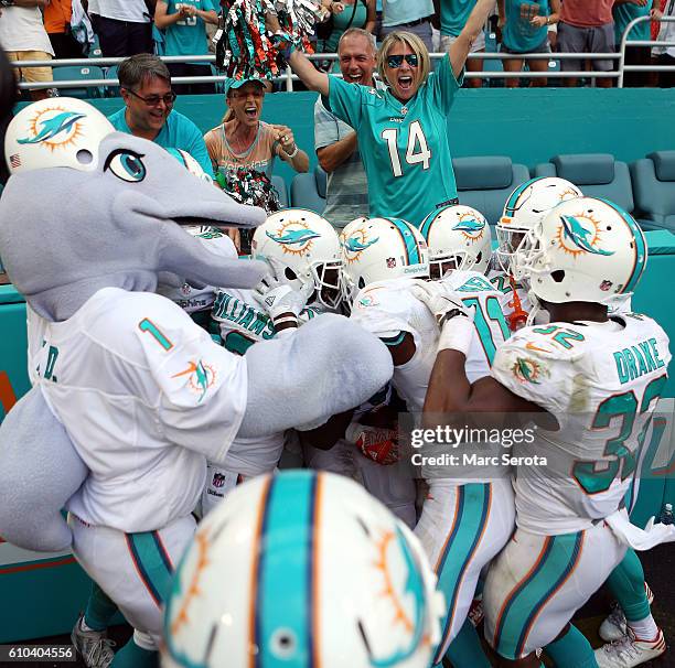 Jay Ajayi of the Miami Dolphins celebrates scoring the winning touchdown against the Cleveland Browns in the first quarter on September 25, 2016 in...