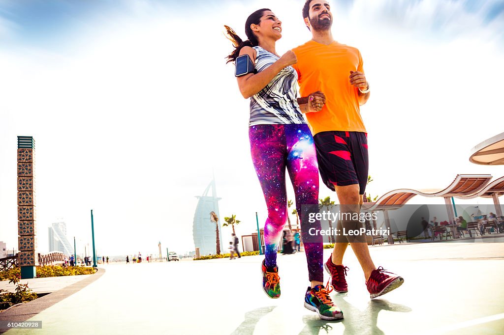 Young couple running - Fitness and exercising in Dubai