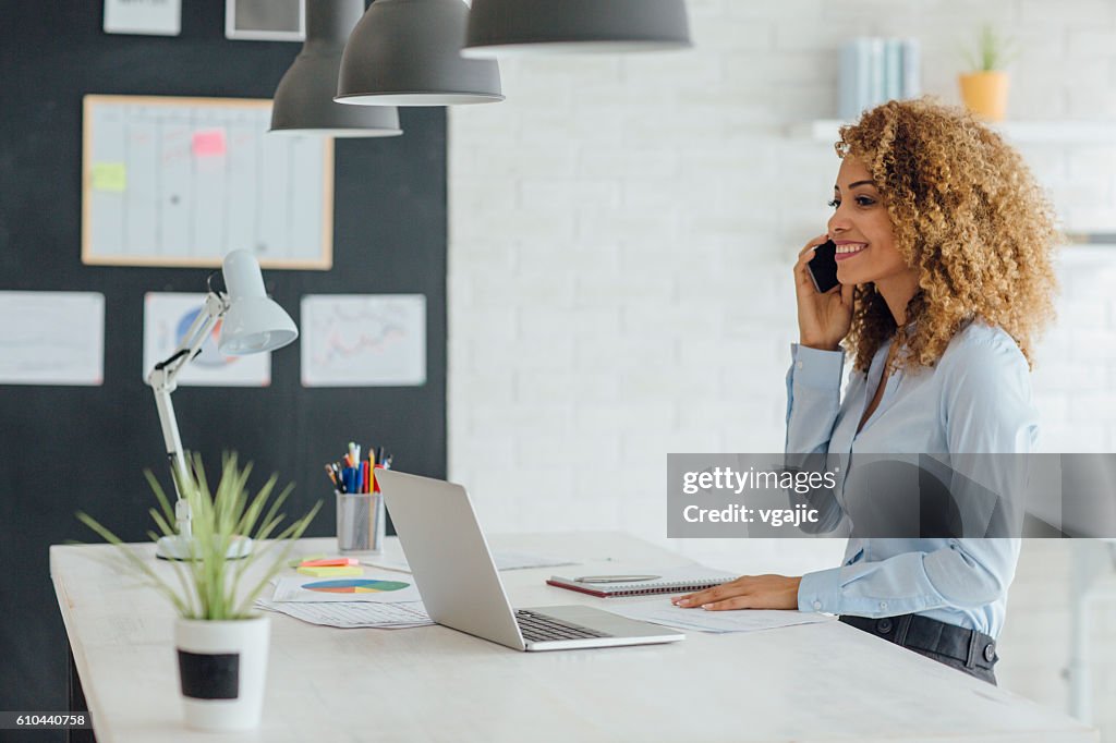 Latina Businesswoman Working In Her Office