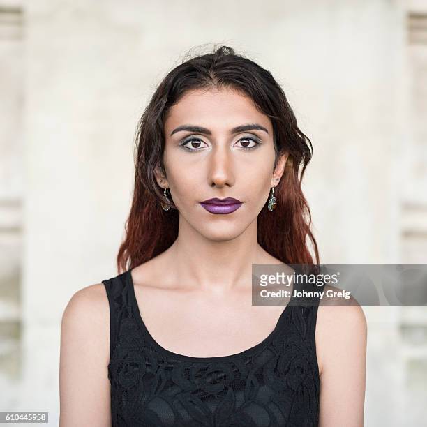 portrait of transgender female wearing black top looking towards camera - black transgender 個照片及圖片檔