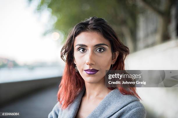 portrait of transgender female looking towards camera - androgyn stock pictures, royalty-free photos & images