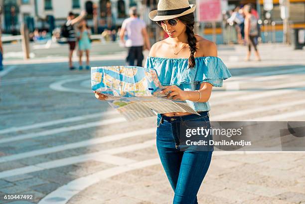 young tourist woman exploring the city - foreign born stock pictures, royalty-free photos & images