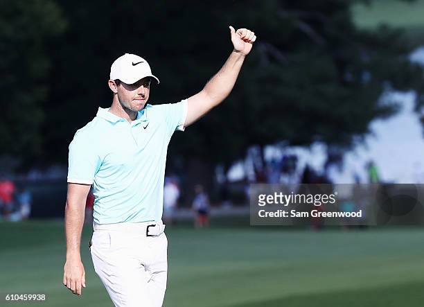 Rory McIlroy of Northern Ireland celebrates after holing a shot for eagle on the 16th hole during the final round of the TOUR Championship at East...