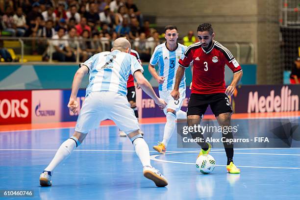Abdelrahman Elashwal of Egypt conducts the ball in front of Damian Stazzone of Argentina during the FIFA Futsal World Cup Quarter-Final match between...
