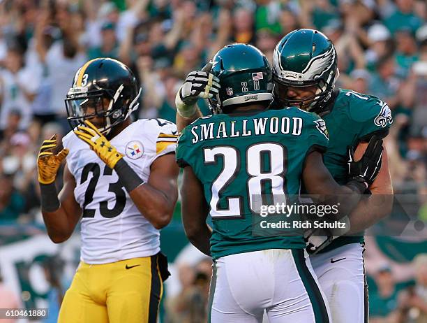 Wendell Smallwood of the Philadelphia Eagles celebrates his rushing-touchdown with teammate Allen Barbre as Mike Mitchell of the Pittsburgh Steelers...